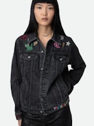 Jeansjacke Kasy - Graue Oversize-Jacke aus Denim mit aufgestickten, aufgesteppten Motiven und Verzierungen von Humberto Cruz.