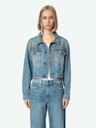 Aretha Cropped Patches Jacket - Women's medium wash cropped denim jacket with Warner Bros. patch on back.