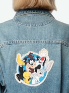 Aretha Cropped Patches Jacket - Women's medium wash cropped denim jacket with Warner Bros. patch on back.