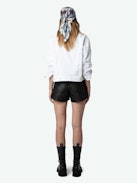 Kaely Denim Jacket - White button-up denim jacket with pockets, raw edges and ‘Love Yourself’ embroidered on the back.