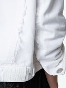 Kaely Denim Jacket - White button-up denim jacket with pockets, raw edges and ‘Love Yourself’ embroidered on the back.