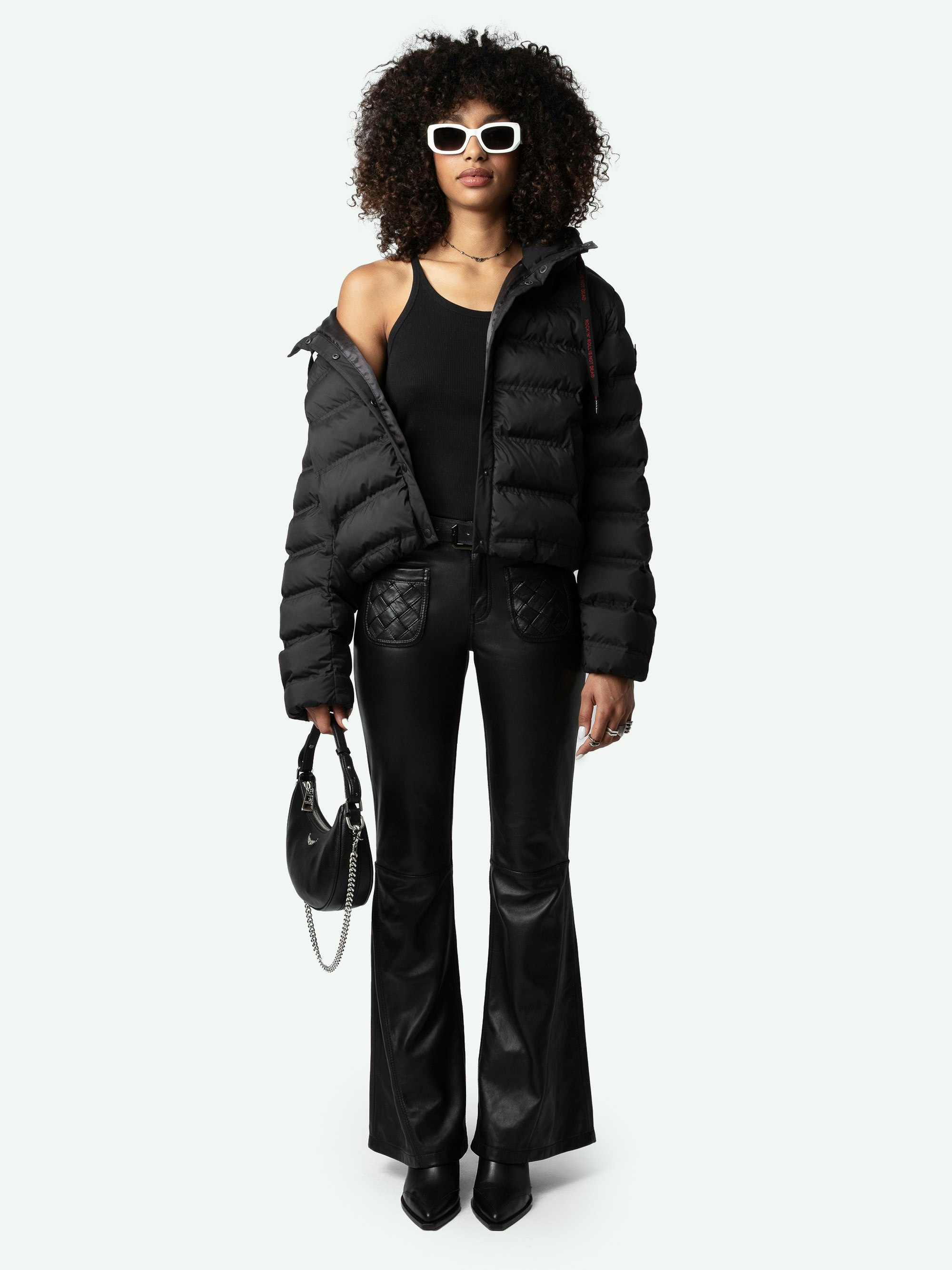 Keli Puffer Coat - Short black quilted puffer coat with drawstring hood, pockets and signature wings on left arm.