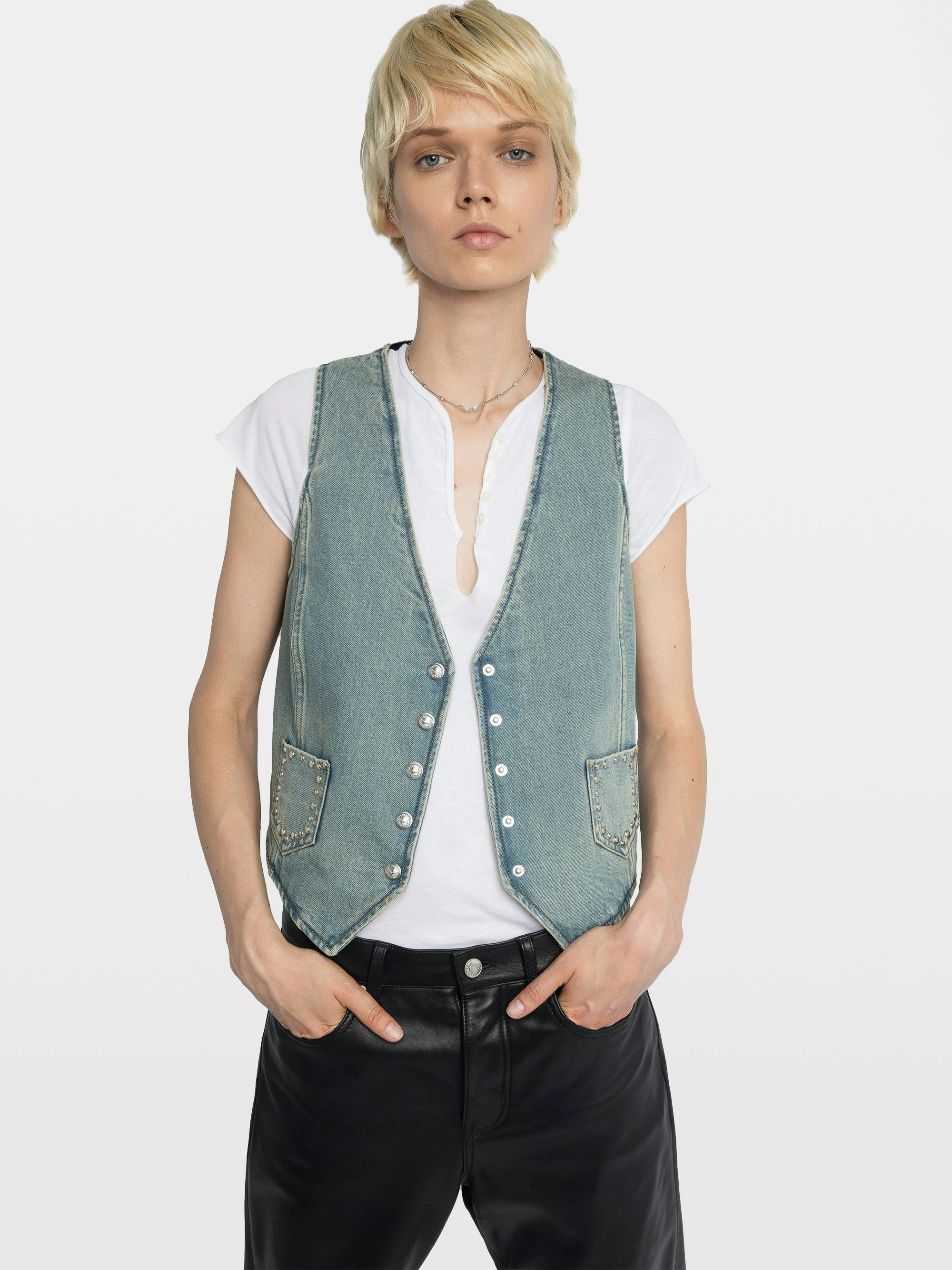 Gillier Denim Vest - This sleeveless denim vest is punctuated with silver studs and a raw edge finish—distressed just right. Layer it over everything, wear it like armor. Bold, free, undeniably Zadig.