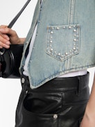Gillier Denim Vest - This sleeveless denim vest is punctuated with silver studs and a raw edge finish—distressed just right. Layer it over everything, wear it like armor. Bold, free, undeniably Zadig.