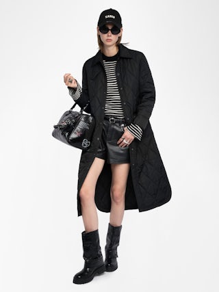 Parka Kina - Parka longue unie matelassée, multi poches et fermeture boutonnée.