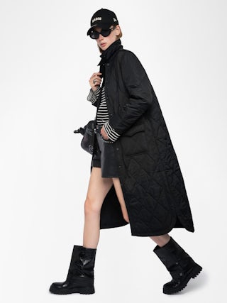 Parka Kina - Parka longue unie matelassée, multi poches et fermeture boutonnée.