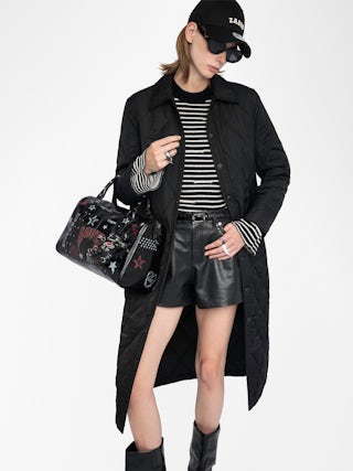 Parka Kina - Parka longue unie matelassée, multi poches et fermeture boutonnée.