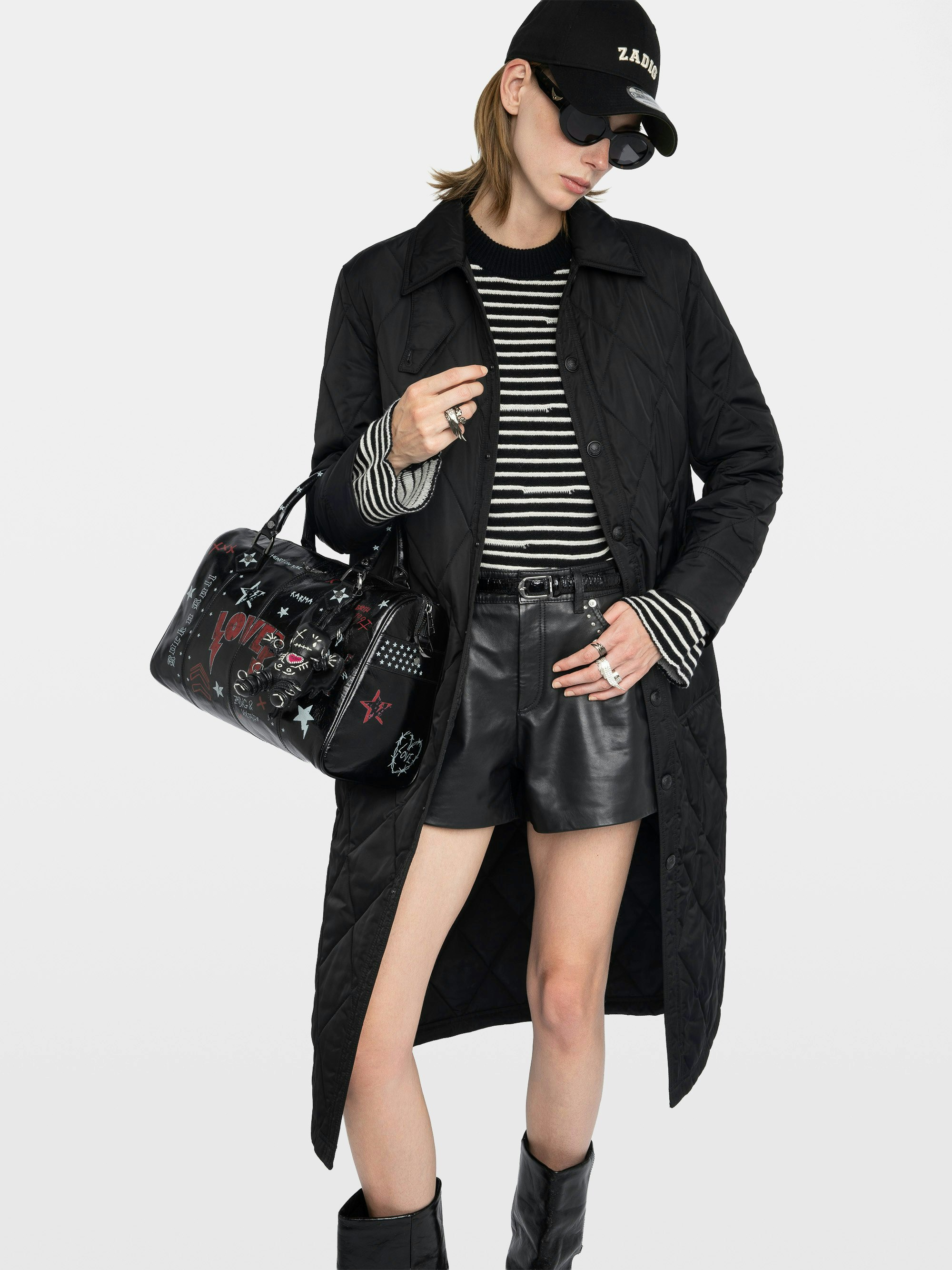 Kina Parka - Long plain quilted parka with multiple pockets and button closure.