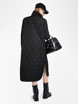 Parka Kina - Parka longue unie matelassée, multi poches et fermeture boutonnée.