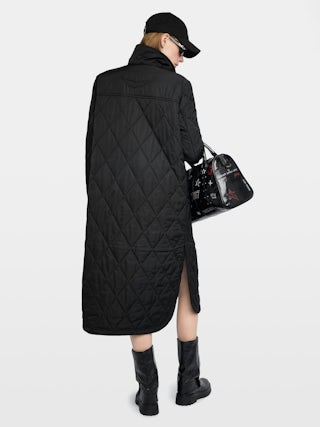 Parka Kina - Parka longue unie matelassée, multi poches et fermeture boutonnée.