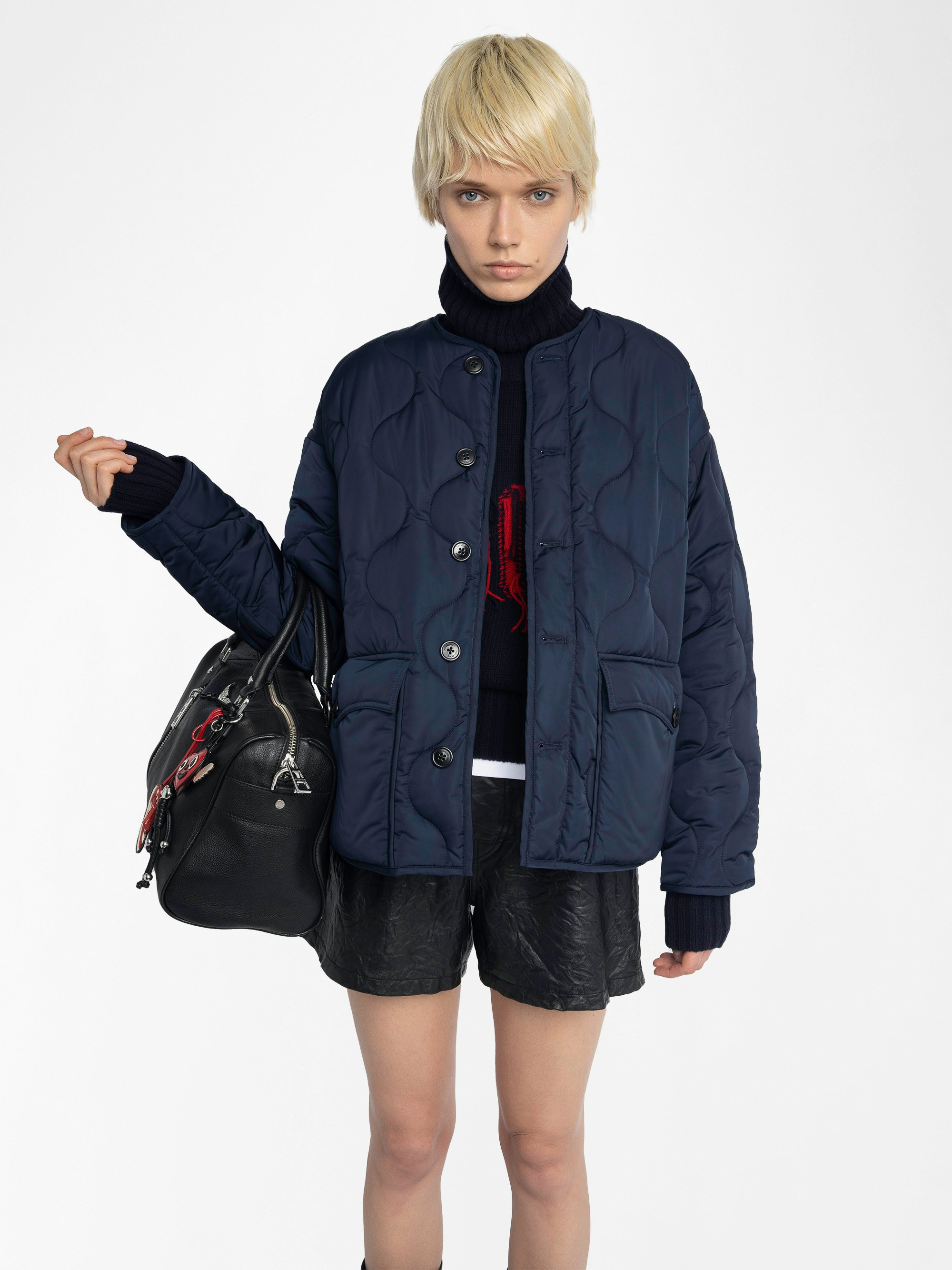 Bunji Parka - Short quilted parka, front patch pockets, and button closure.