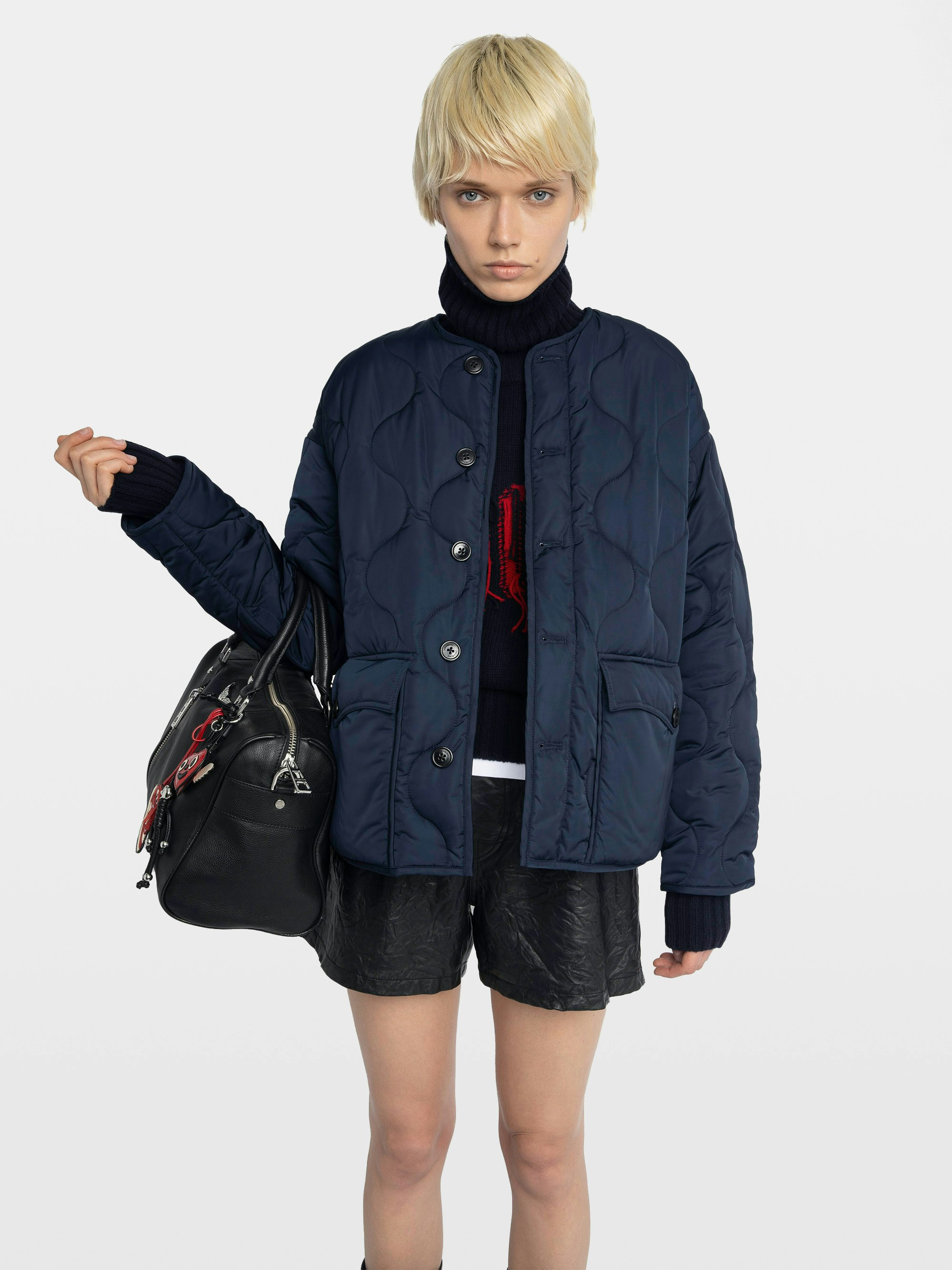 Bunji Short Quilted Parka - Short quilted parka, front patch pockets, and button closure.