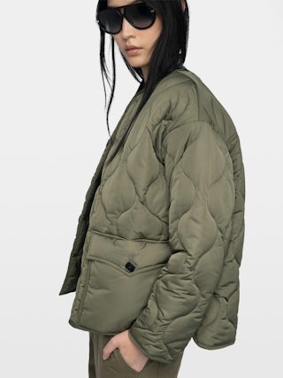 Bunji Short Quilted Parka - Short quilted parka with front patch pockets and button closure.