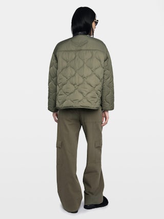 Bunji Short Quilted Parka - Short quilted parka with front patch pockets and button closure.