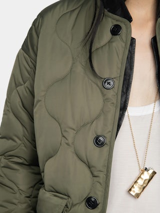 Bunji Short Quilted Parka - Short quilted parka with front patch pockets and button closure.
