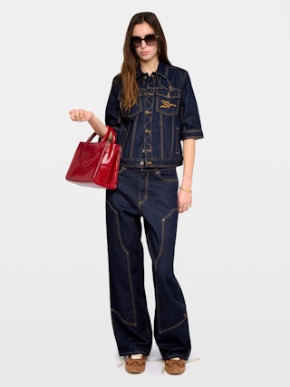 Kyo Denim Jacket - Short-sleeved denim jacket with button fastenings, removable flap and multiple pockets.