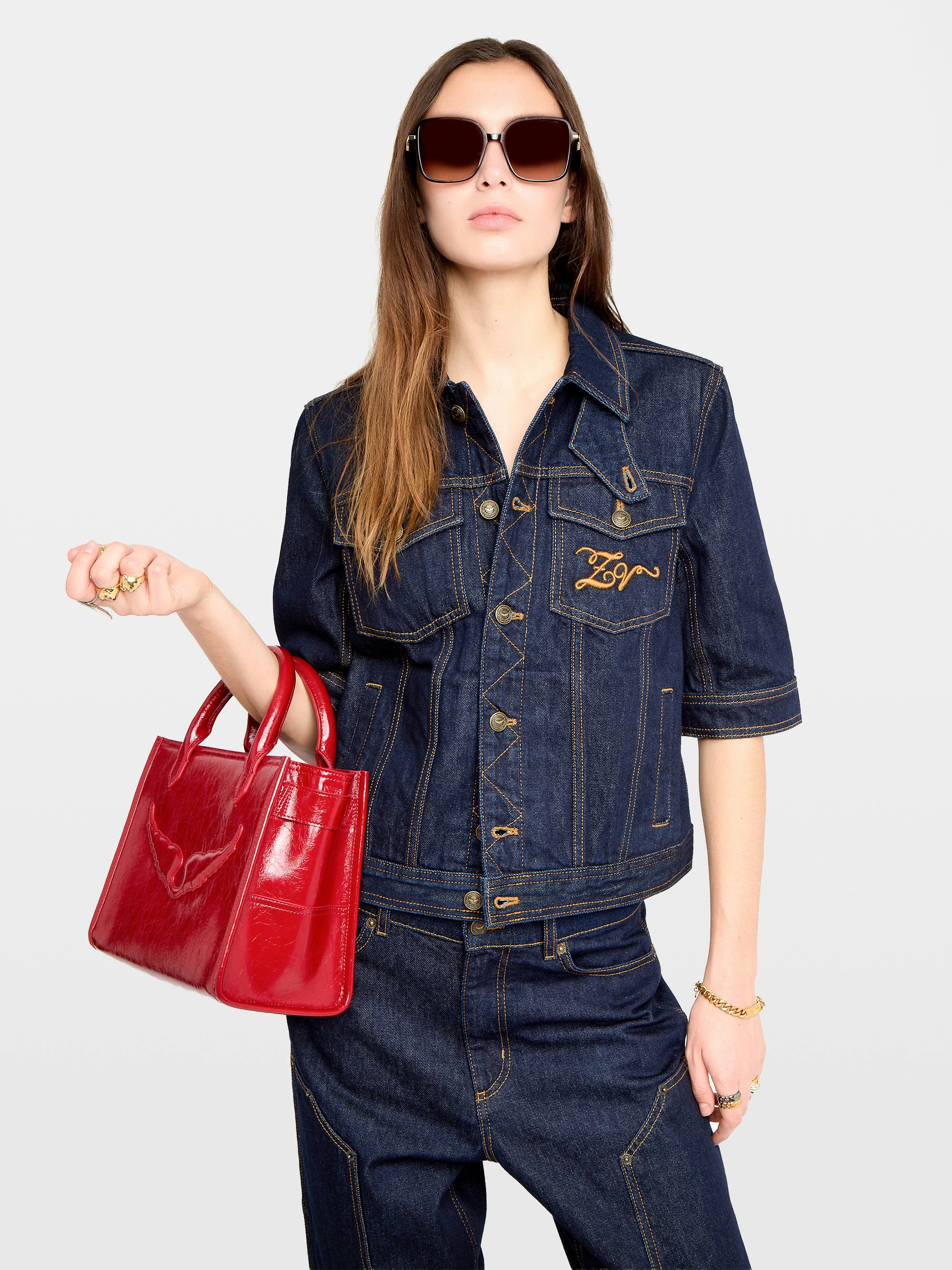 Kyo Denim Jacket - Short-sleeved denim jacket with button fastenings, removable flap and multiple pockets.