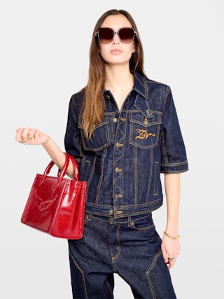 Kyo Denim Jacket - Short-sleeved denim jacket with button fastenings, removable flap and multiple pockets.