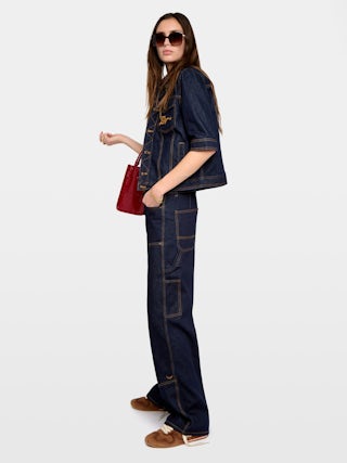 Kyo Denim Jacket - Short-sleeved denim jacket with button fastenings, removable flap and multiple pockets.