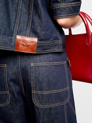 Kyo Denim Jacket - Short-sleeved denim jacket with button fastenings, removable flap and multiple pockets.