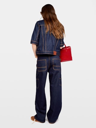 Kyo Denim Jacket - Short-sleeved denim jacket with button fastenings, removable flap and multiple pockets.