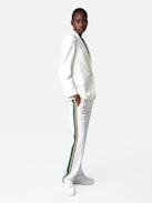 Pomy Trousers - White crêpe trousers with glittery side bands and drawstring ties.
