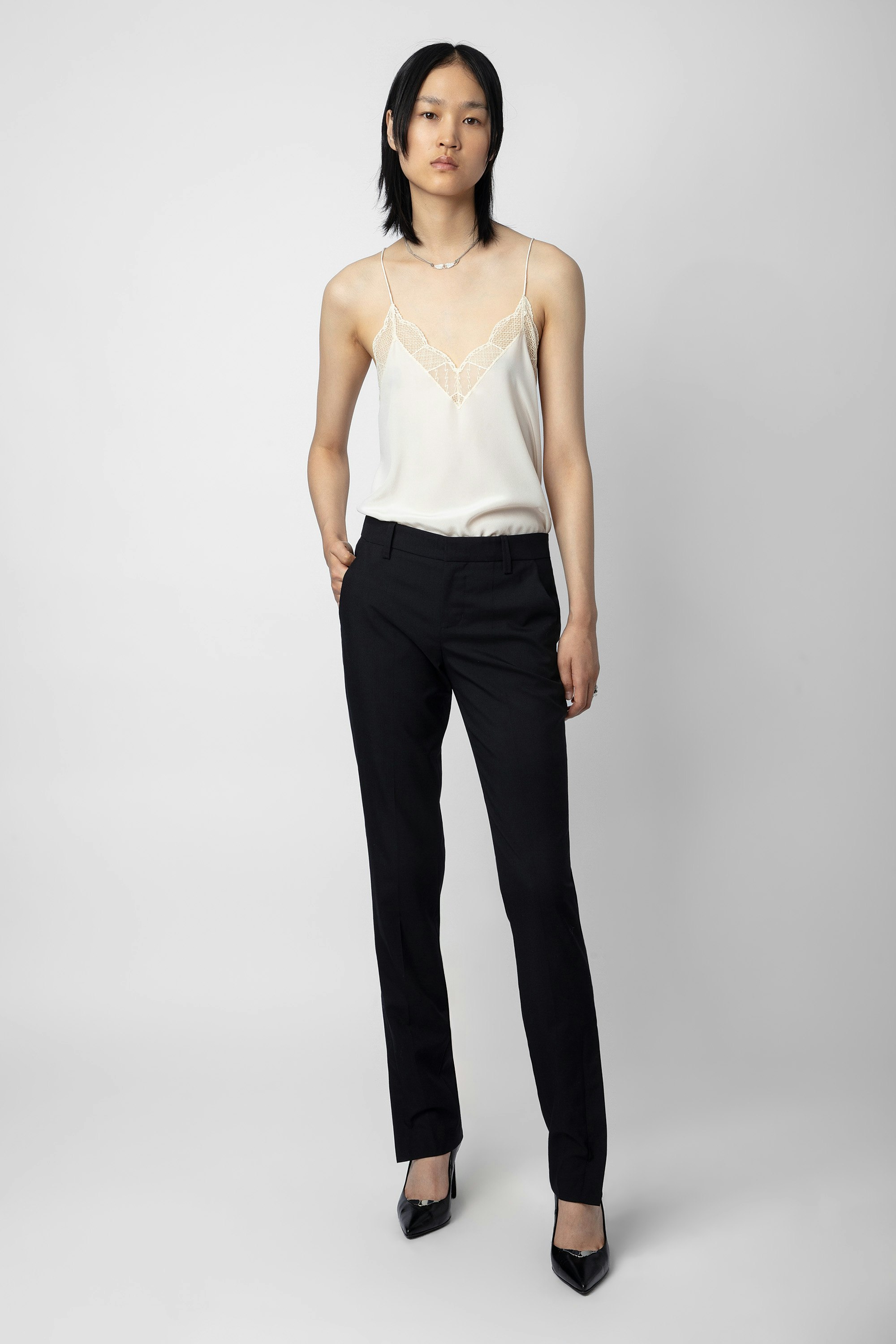 Prune Trousers - Women’s black tailored trousers with zipped hem.