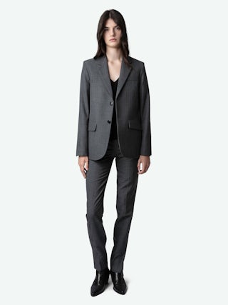 Pantalon Prune - Pantalon de tailleur anthracite à rayures, monogramme et ourlets zippés.