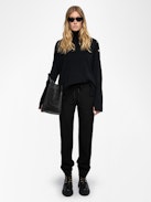 Pantalón Pomy - Pantalón negro con bandas laterales de purpurina.
