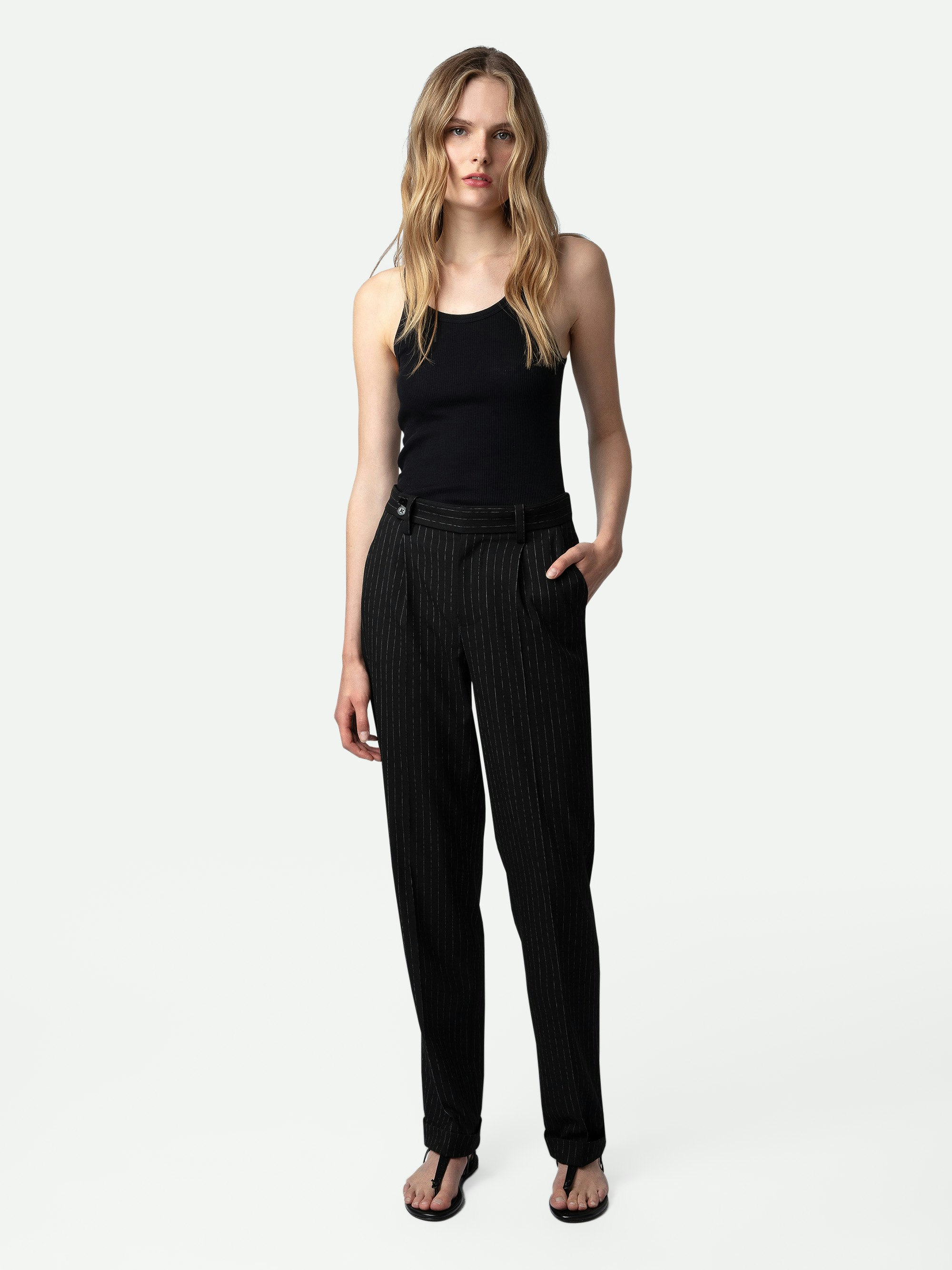 Pura Trousers - Black wide-leg tailored trousers with pinstripes and pockets.