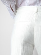 Pistol Pants - White linen flared tailored pants with pockets and pleats.