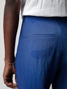 Pistol Trousers - Blue linen flared tailored trousers with pockets and pleats.