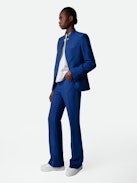Pistol Trousers - Blue linen flared tailored trousers with pockets and pleats.