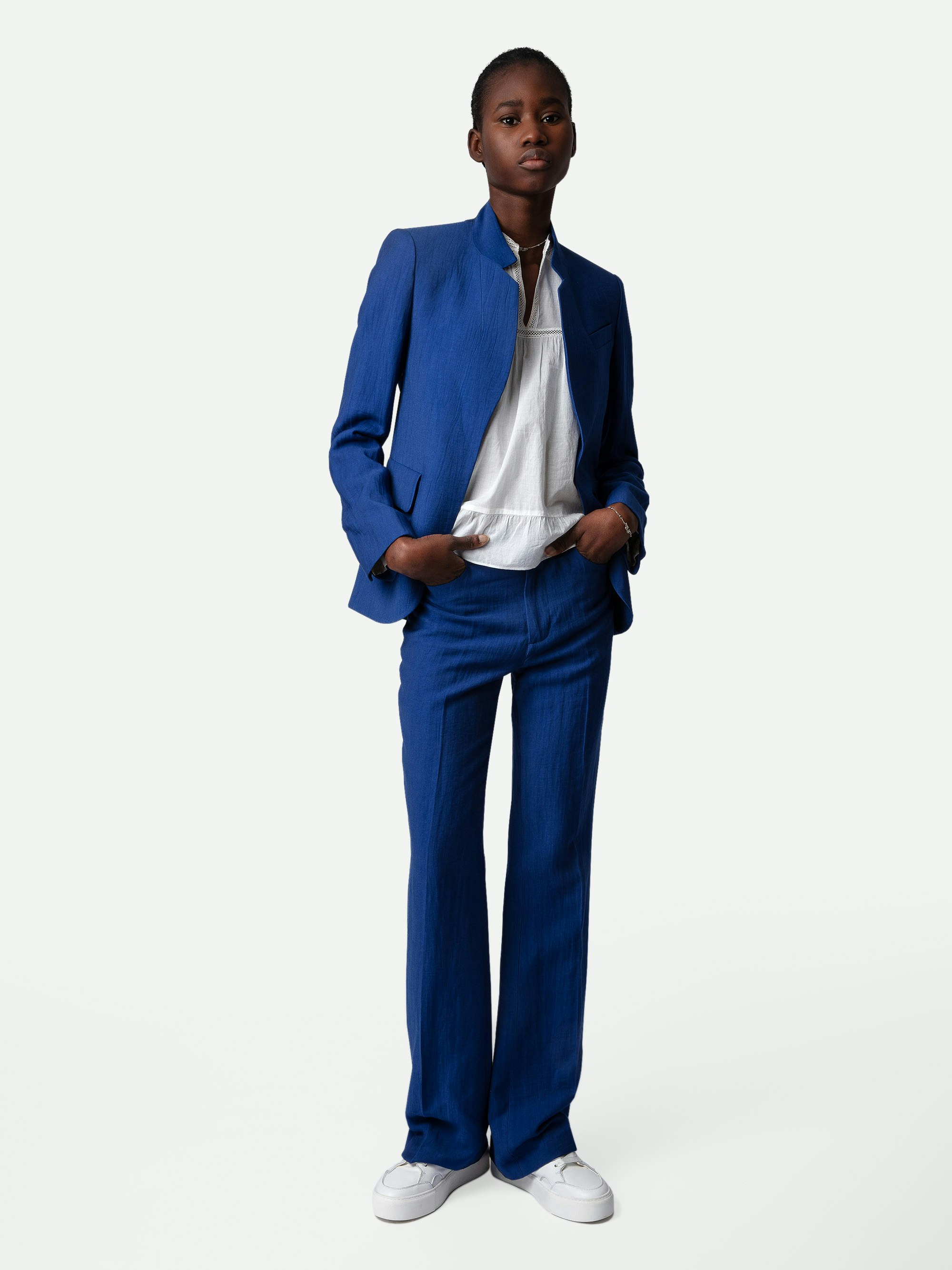 Pistol Trousers - Blue linen flared tailored trousers with pockets and pleats.