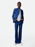 Pistol Trousers - Blue linen flared tailored trousers with pockets and pleats.