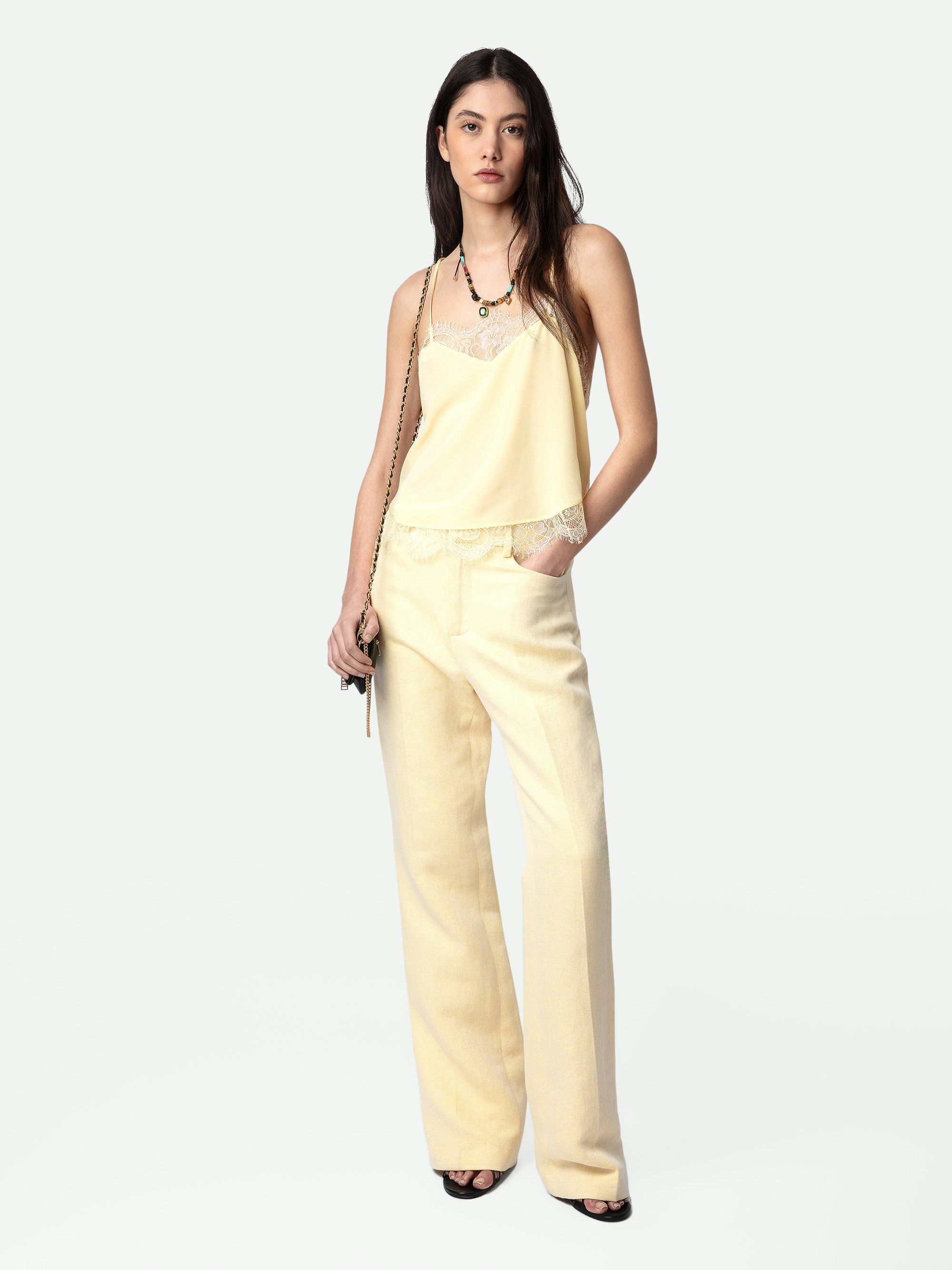 Pistol Pants - Light yellow linen flared tailored pants with pockets and pleats.
