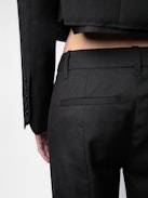 Poxy Pants - Black cool wool loose-fitting tailored pants with asymmetric fly and raw details.