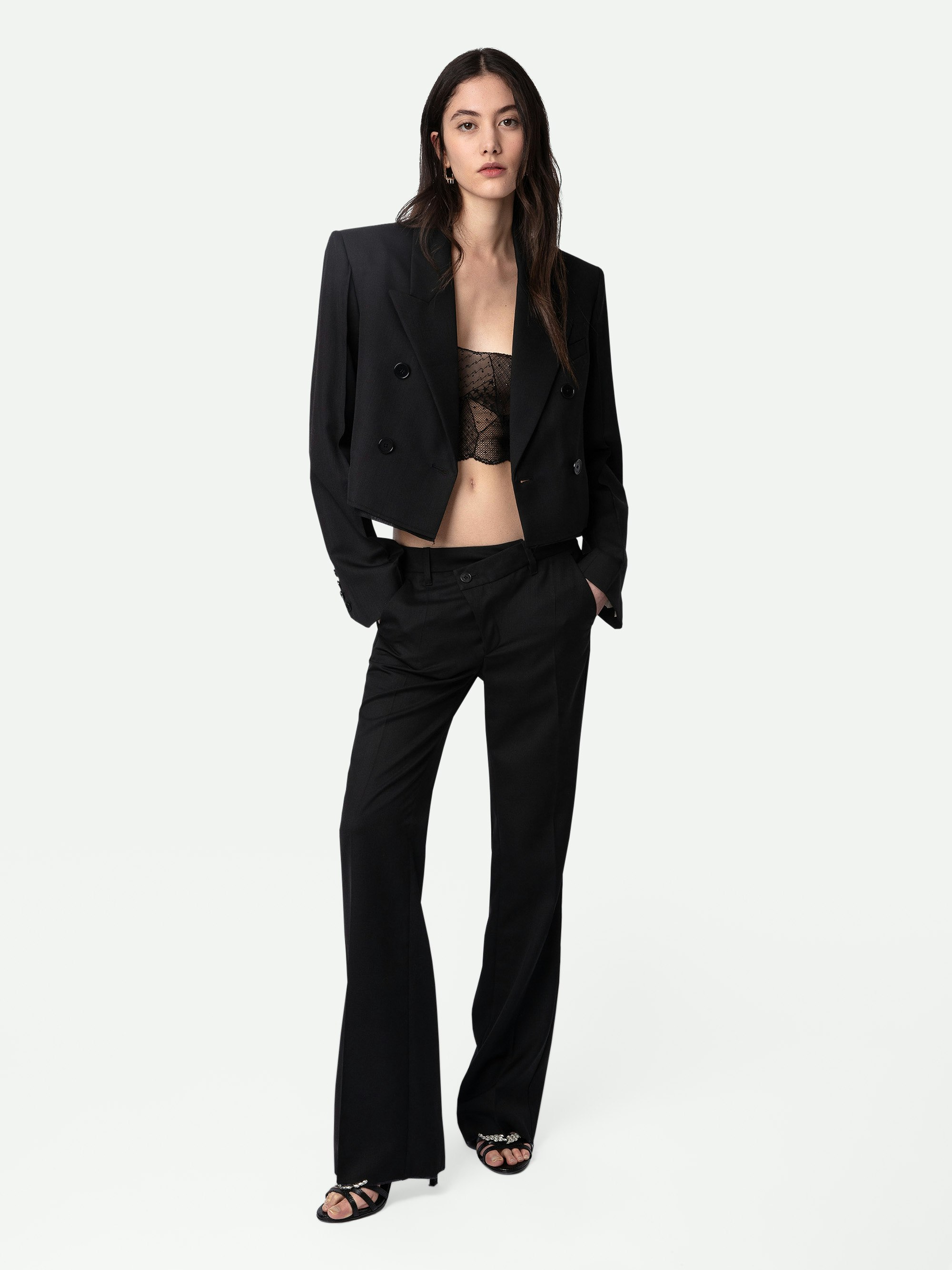 Pantalón Poxy - Pantalón de traje negro ancho de lana fría con cierre asimétrico y detalles sin rematar.
