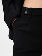 Pura Trousers - Black crêpe tailored trousers with pockets and hems.