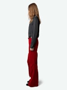 Prevy Velvet Pants - Flared red velvet pants with a mid-rise waist and pockets.