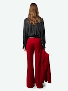 Prevy Velvet Pants - Flared red velvet pants with a mid-rise waist and pockets.