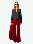 Prevy Velvet Pants - Flared red velvet pants with a mid-rise waist and pockets.