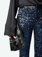 Prevy Sequin Pants - Dark blue flared pants with sequins, mid-rise waist and pockets.
