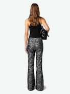 Pantaloni Prevy Lustrini - Pantaloni a zampa neri con lustrini argentati, gambe svasate, vita medio-alta e tasche.