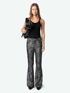 Pantaloni Prevy Lustrini - Pantaloni a zampa neri con lustrini argentati, gambe svasate, vita medio-alta e tasche.