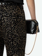 Prevy Velvet Pants - Black sequin flare pants with mid-rise waist, sequins, and pockets.