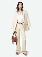 Pistol Pants - A masterful blend of classic tailoring and modern sophistication. These flared, tailored pants are crafted from premium cotton with a refined weave, offering a structured yet comfortable fit. Featuring practical pockets and a sleek silhouette, the Pistol Pants transition effortlessly from day to night.