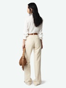 Pistol Pants - A masterful blend of classic tailoring and modern sophistication. These flared, tailored pants are crafted from premium cotton with a refined weave, offering a structured yet comfortable fit. Featuring practical pockets and a sleek silhouette, the Pistol Pants transition effortlessly from day to night.