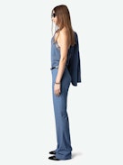 Pistol Pants - Flared tailored pants with pockets and pleats in a mottled fabric.