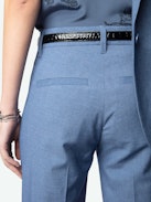 Pistol Pants - Flared tailored pants with pockets and pleats in a mottled fabric.